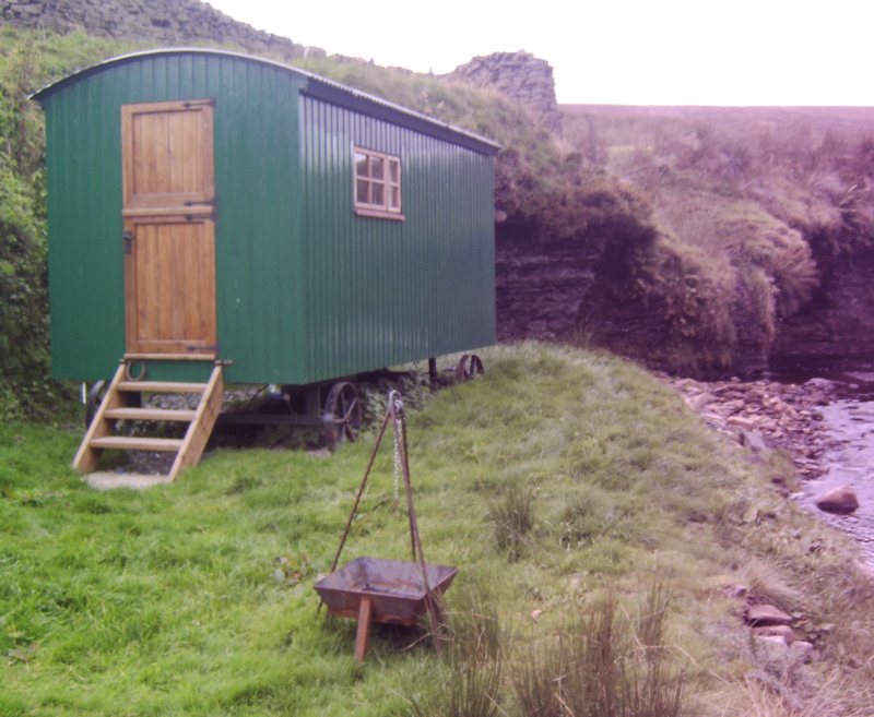 Come and experience a night in our traditionally themed shepherd's hut, nestled in a secluded, sheltered, riverside setting on our remote working hill farm at the head of Swaledale.

Regardless of the weather, you can look forward to a snug relaxing evening in our hut; for cold, wintry days there's plenty of fuel supplied for the woodburning stove, whereas warm evenings can be spent dipping your toes in the river whilst enjoying the peaceful quiet surroundings.

The hut sleeps two (2 singles) and the promise of a breakfast delivered to your door make this an overnight stay with a difference. Evening meals and packed lunches can be provided by prior arrangement.

The Shepherds hut is available from May until October.