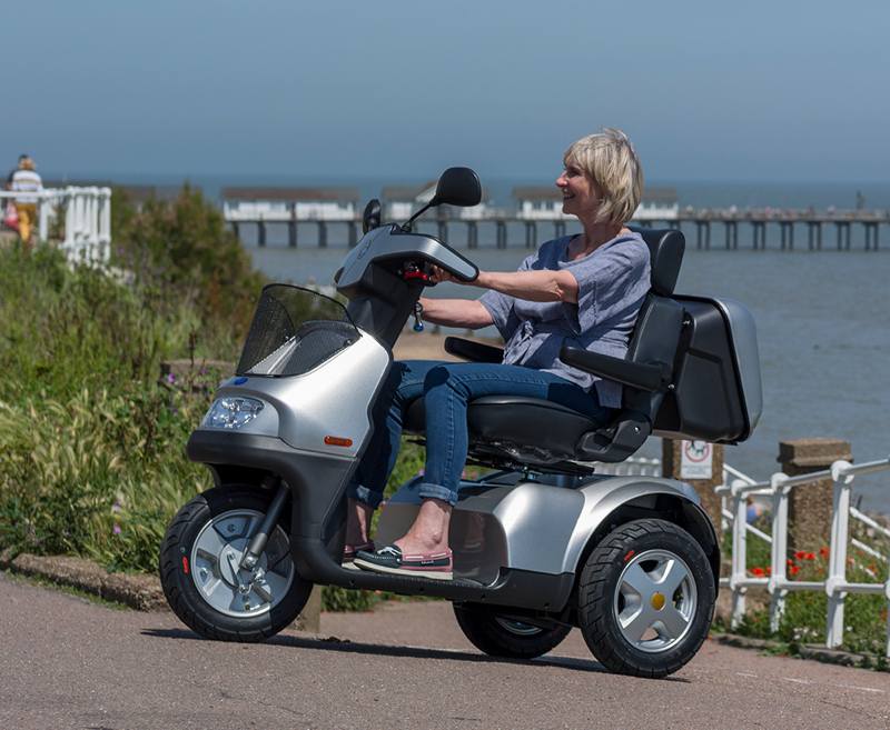 The iconic Breeze brand from TGA has an established and respected reputation for providing unsurpassed reliability, comfort and quality. The 4-wheel Breeze S4 delivers superb stability and traction when tackling slopes and challenging terrain as seen when it appeared on BBC Top Gear.
This scooter has all the capabilities for enjoyable countryside and coastal rambles with a 30-mile range and a powerful transaxle motor. The 3-wheel Breeze S3 delivers the same exceptional performance and enhanced manoeuvrability. If all-weather independence is a must then both models are available with optional rigid canopy for protection against wind and rain.
[symple_button url=