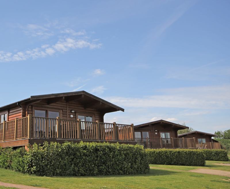 Luxurious 4* self-catering holiday accommodation in rural Rutland. The lodges at Greetham Valley offer the perfect venue for a relaxing break to explore the surrounding area. Our eight eco-friendly log cabins comfortably sleep up to 6 adults plus a cot. Each have three bedrooms, two bathrooms and are furnished to a very high standard.
Five of the lodges are pet-friendly at no extra cost. There is even a restaurant and lounge bar in the hotel on site for your convenience. There are some fantastic public footpaths on your doorstep with Rutland Water just a few miles away.