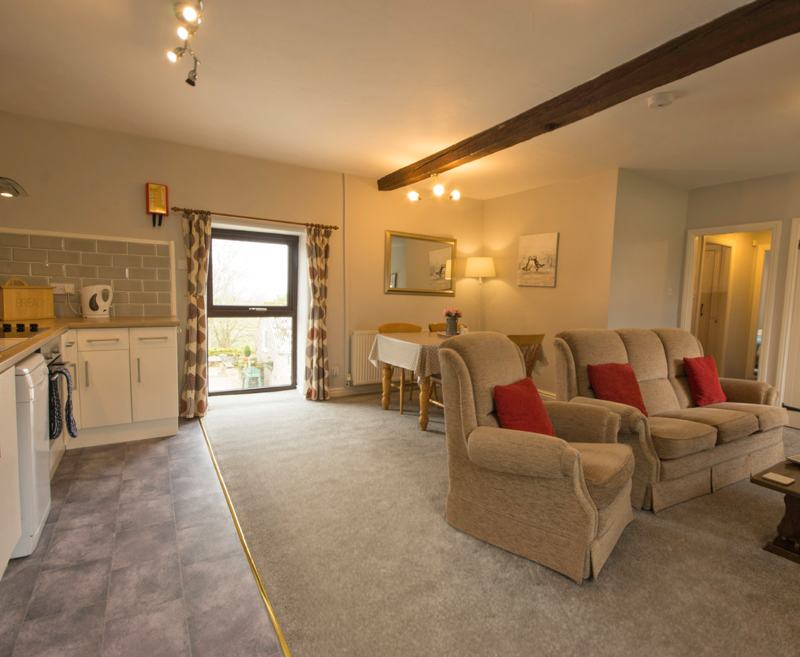 A spacious, light and airy double-aspect cottage which leads out on to the guest garden. The cottage contains a large open living/dining/kitchen area, with a hallway leading to one double bedroom and one twin bedroom. The bathroom includes a shower over bath.

Lathkill is popular with old and young alike. With its easy access to the guest garden, it is ideal for families or couples wishing to enjoy the grounds and a glorious outdoor seating area.

Occupancy: Maximum 4 adults (+ a cot)
Dogs: 1 small/medium dog (to be used as a guide only – please contact us regarding individual requirements)