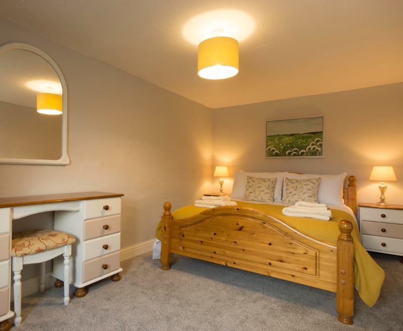 An attractive split-level cottage which has a window view onto the guest garden.  The ground floor consists of an open plan living/dining/kitchen area and a double bedroom. Upstairs leads to a large twin bedroom and bathroom which includes a shower over bath.

Magpie is ideal for families, two couples enjoying a week away together or two people wishing to have the privacy of their own bedrooms. Magpie provides the cosiness of a small cottage with the flexibility of modern living.

Occupancy: Maximum 4 adults (+ a cot)
Dogs: When 4 adults; 1 small/medium dog.  When 2 adults; up to 2 medium dogs (to be used as a guide only – please contact us regarding individual requirements)