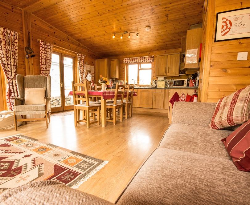 Four cosy and contemporary log cabins, fully equipped with everything you need for a relaxing holiday in the Derbyshire hills. With level thresholds and easy access, the spacious rooms all have stunning views over the farm fields, so you can relax and watch the wildlife. 

A real home from home with, super king size double beds, modern bathrooms with luxurious whirlpool baths, and outdoor furniture. Children will love feeding the chickens and having fun on the play area. 

There is a small shop on site selling basic supplies, and ample parking. Some of the log cabins even have their own private hot tubs to help sooth those aching limbs after a hard days walking.