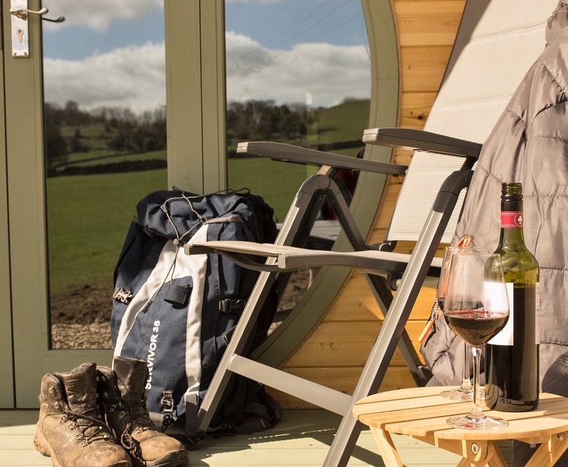 Stay in one of our modern chic self-contained glamping pods. You’ll sleep well on the comfortable king size sofa bed and wake up to stunning views from your pillow through the Hobbit inspired circular doors. 

There is a sweet little contemporary kitchenette with hob, microwave, fridge, and even a kitchen sink, or you can cook on the outdoor BBQ. Bedding, towels, lighting, heating, phone charging and free WiFi included.

No need to trudge over the fields in the dead of night to go to the toilet, as the glamping pods have a spacious shower room and toilet.