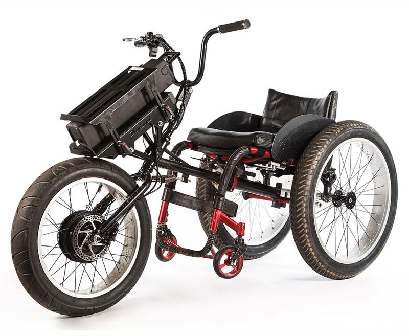 The DaVinci Beach Trailrider electric powered front wheel attachment fits most rigid frame wheelchairs and allows the user to travel on terrain which would otherwise be almost impossible.
It has a 500watt, high-torque gear drive motor with high-power programmable 12fet controller. The distance travelled depends on a number of factors speed, weight of rider, terrain and temperature. However, generally an 80kg rider on reasonably flat terrain at about 10 to 12 mph could get up to 20 miles on a 10ah 36volt battery.
On sand there is much more resistance and more power and energy is required to travel the same distance so the Beach Trailrider comes with a 28ah 36v battery. The 24” x 4” wide beach wheels complete the kit.