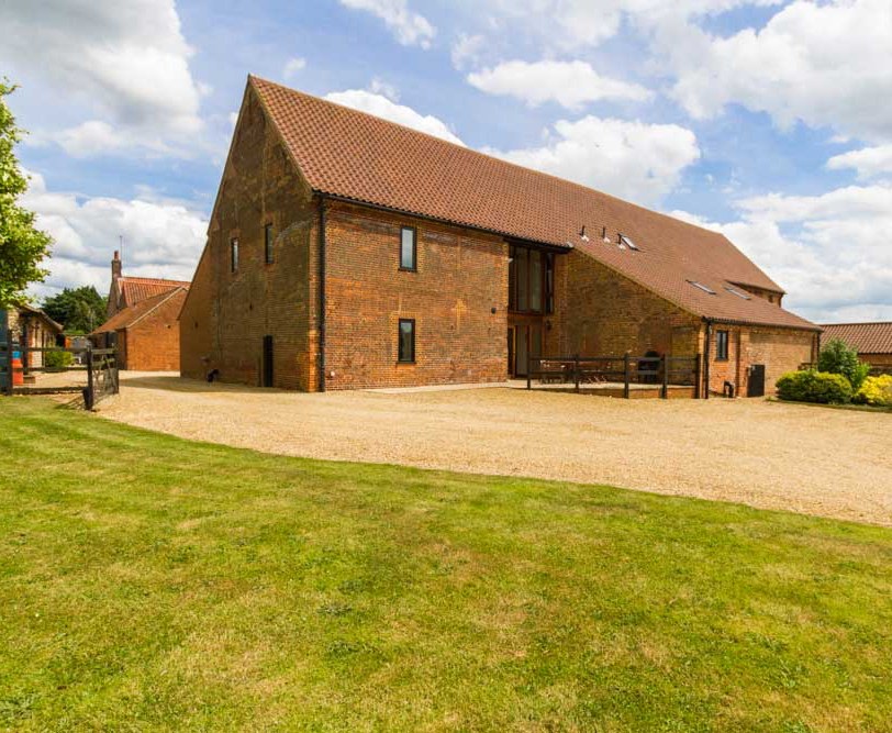 The Dresser is a large open planned barn conversion, spread over 2 floors with beautiful views over the Norfolk countryside. The open plan downstairs living space benefits from under floor heating with the upstairs rooms centrally heated.

It benefits from ample parking right outside the cottage and level access in and around the cottage to the patio area at the back.

The living and dining area on the ground floor is wheelchair friendly with ample comfortable seating, TV/DVD player and a farmhouse table that seats 10.

The kitchen is equipped with a low level hob unit and work surfaces. There are 2 ovens, one standard size as well as a larger range style oven together with a fridge/freezer, dishwasher, microwave and a second table seating 6. There is also a utility room which houses the washing machine and a downstairs WC.