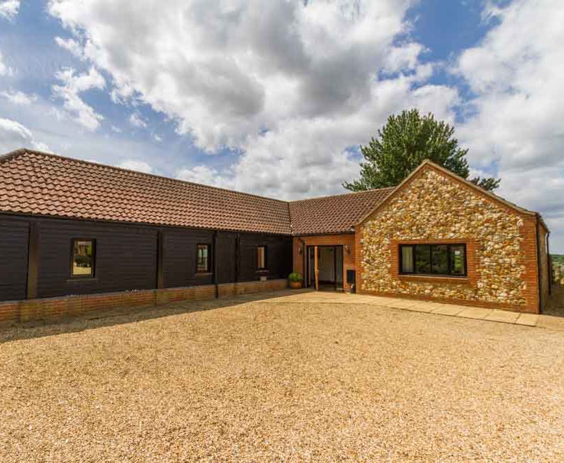 This detached, single storey cottage has been recently refurbished to offer a higher standard of accommodation for 6 people, with fantastic views over the North Norfolk countryside.

It benefits from ample parking right outside the cottage and level access throughout the cottage to the patio and lawn garden area at the back.

The open plan kitchen and dining space is fully equipped with everything you need. There is a low level hob unit, oven and some low level units integrated with normal height work surfaces. There is also a fridge, microwave and washer/drier. The central farmhouse dining table comfortably seats six.

Watch the sunset from the spacious living room complete with comfortable seating and TV/DVD player. Patio doors open out onto the garden seating area where you can soak up the view.

There are three bedrooms, one double room and two twin rooms. The double and larger twin rooms share access to a large roll-in shower room with bath, toilet and wash basin. There is also a second bathroom with bath, toilet and wash basin.

It is fully centrally heated and has its own enclosed garden and patio area.