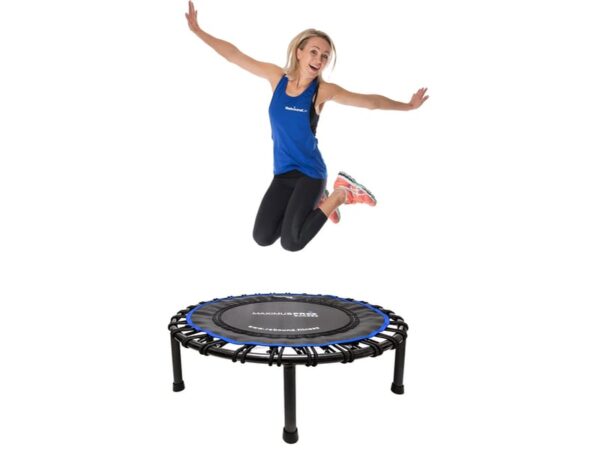 Rebounding trampoline, a woman mid-air enjoying the benefits of rebounding fitness.